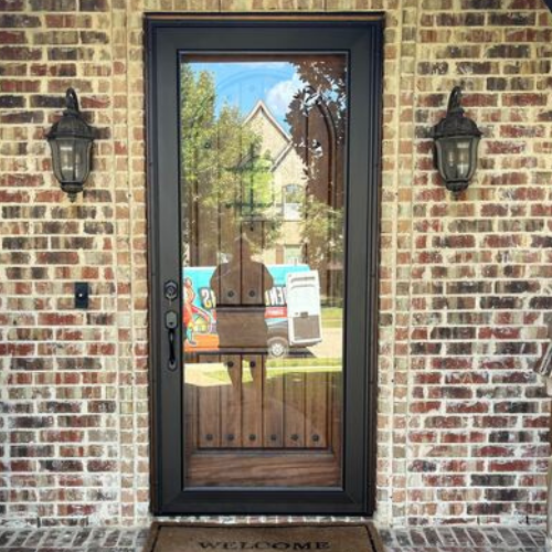 Den Defenders luxury storm door with full-length glass panel providing clear views and weather protection